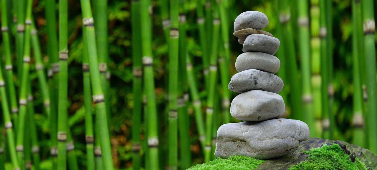 Zen stacked stones with bamboo - wellness and balance